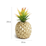 gold pineapple plant and green plant office desk decoration