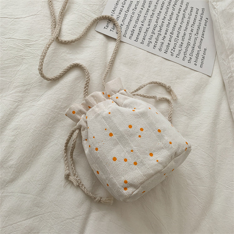 Artistry in Miniature: Literary Canvas Messenger Bucket Bag
