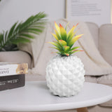 white pineapple plant and green plant office desk decoration