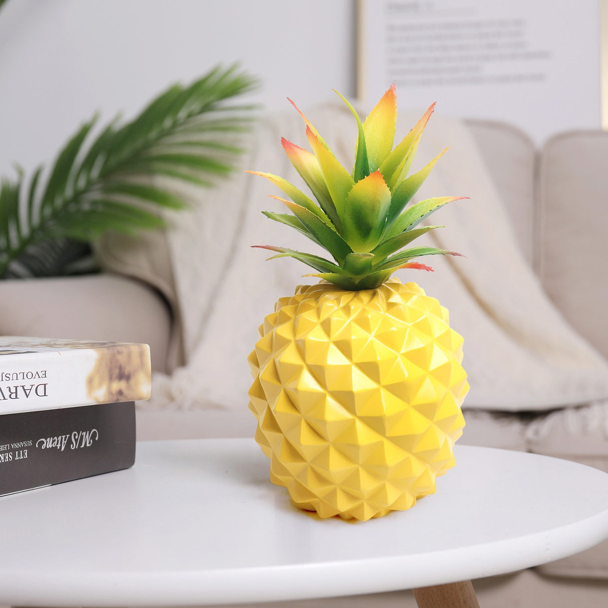 Yellow pineapple plant and green plant office desk decoration