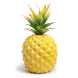 Yellow pineapple plant and green plant office desk decoration