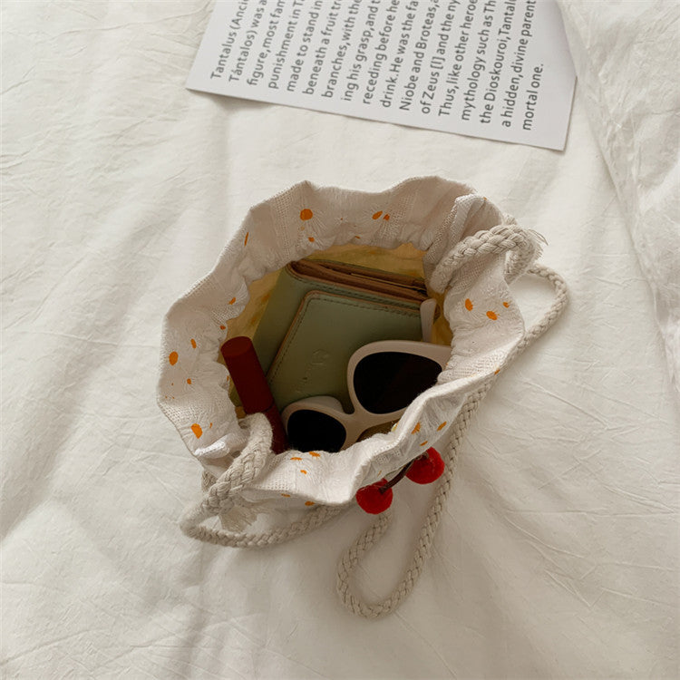 Artistry in Miniature: Literary Canvas Messenger Bucket Bag